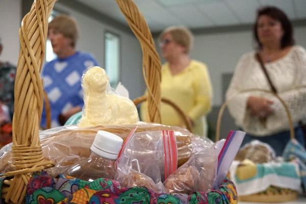 Butter molded in the shape of a lamb sits atop a loaf of bread during the traditional Polish Easter basket blessing, also known as “Swieconka” (shvyehn-SOHN-kah), when Father Norbert Rappold, pastor at St. Peter the Fisherman Church in Mountain Home, blessed a variety of baskets brought by parishioners April 20. Traditional basket items, including eggs, ham and horseradish, have symbolic meanings. (Aprille Hanson photo)
