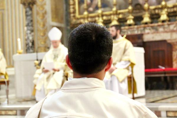 Father Martín Amaro stands before Bishop Anthony B. Taylor during his ordination Mass May 11 in St. Peter Basilica at the Vatican. Father Amaro attended the North American College in Rome for the past four years and chose to be ordained in Italy. (Denis Nakkeeran photo, Pontifical North American College)