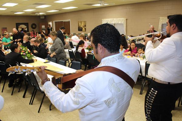 An estimated crowd of 300 guests enjoy dinner and music May 17. The crowd witnessed Daniel Velasco's ordination to the transitional diaconate, the first vocation from St. James Church in Searcy. (Dwain Hebda photo)