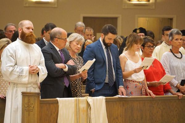 Seminarian Joseph Friend stands with his father Dr. Jerry Friend, stepmother Dona and other family members at the beginning of his diaconate ordination Mass May 22 at Christ the King Church in Little Rock. (Malea Hargett photo)