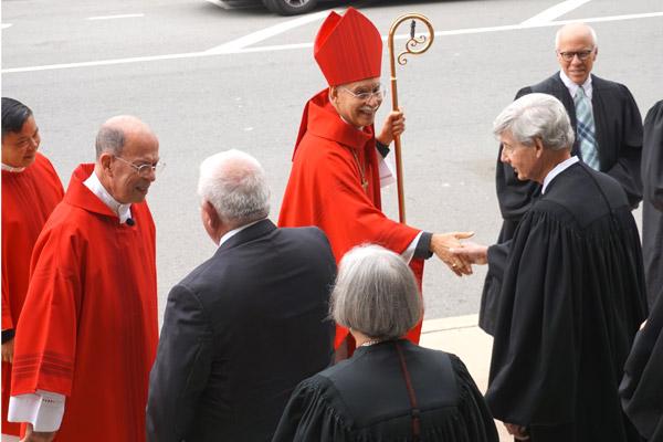 Bishop Taylor greets Pulaski County District Court judge Wayne Gruber and others outside the Cathedral of St. Andrew in Little Rock following the Red Mass on Oct. 4. (Aprille Hanson photo)