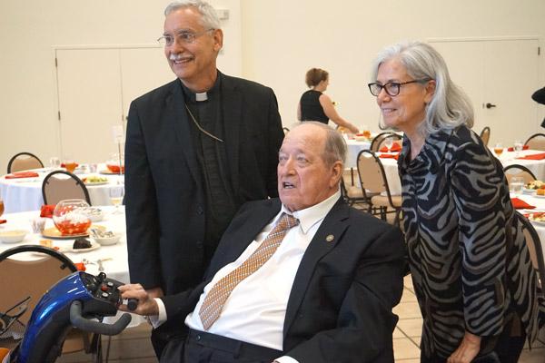 Former judge Charles Baker, a parishioner at Our Lady of the Holy Souls in Little Rock, smiles with Bishop Anthony B. Taylor and former law clerk Lucille DeGostin. Baker received the St. Thomas More Award Oct. 4. (Aprille Hanson photo)