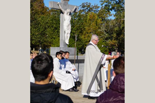Msgr. Francis I. Malone delivers the homily for the All Souls Day Mass Nov. 2 at Calvary Cemetery. (Malea Hargett photo)