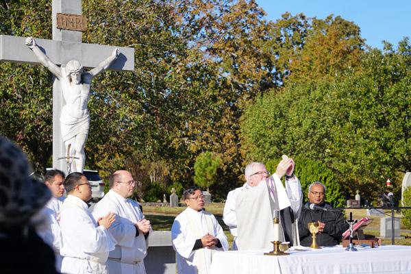 Area priests join Msgr. Francis I. Malone to concelebrate the Nov. 2 outdoor Mass in Little Rock. (Malea Hargett photo)