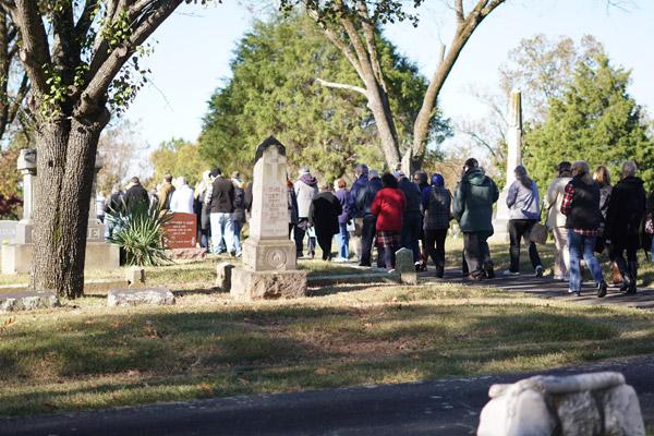 Parishioners bundle up for the Mass and procession around the diocesan cemetery. (Malea Hargett photo)