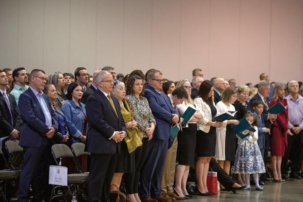 Bishop Francis I. Malone’s siblings and extended family occupy the front row for his ordination and installation at the Shreveport Convention Center. Five of his siblings were gift bearers, and his brother John Malone sang the Litany of the Saints. At the end of Mass, Bishop Malone thanked his family for their love and support. (Bob Ocken photo)