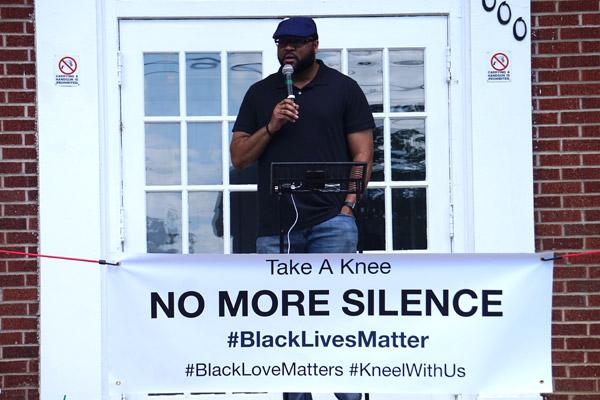 “Take a Knee - a Rally for Justice” organizer Malik Saafir shares how faith leaders need to be vocal in the movement to end racism during the June 6 rally at Theressa Hoover United Methodist Church in Little Rock. (Aprille Hanson photo)
