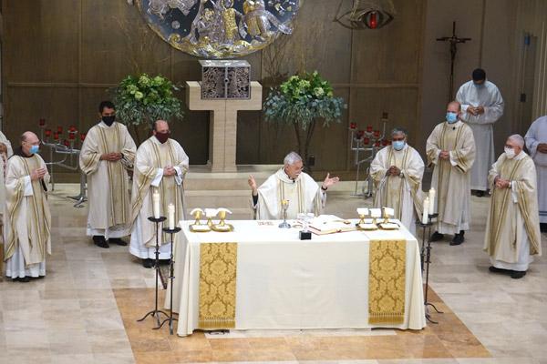 Bishop Anthony B. Taylor celebrates the liturgy of the Eucharist with priests marking their jubilees, including Father Jerome Earley (far left, 25 years), Father Greg Luyet (brown mask, 25 years), Father Amal Raju Punganoor Lourduswamy (25 years) and Abbot Leonard Wangler (50 years). Jubilarians Msgr. J. Gaston Hebert (60 years) and Father Siprianus Ola Rotok (25 years) were not present. (Aprille Hanson photo)