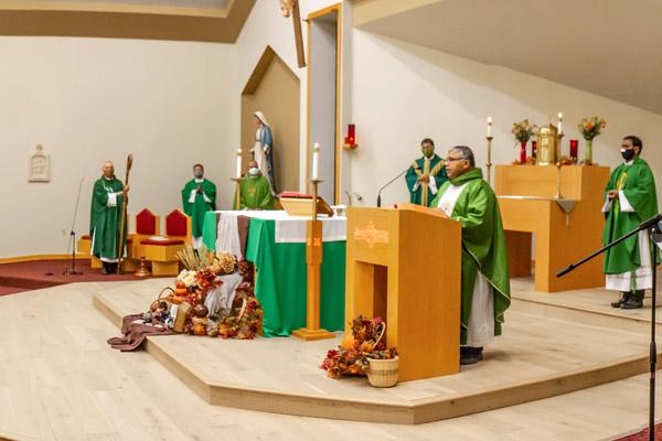 Father Amal Raju Punganoor Lourduswamy speaks during Mass at St. John Newman University Parish in Jonesboro where Bishop Anthony B. Taylor blessed the sanctuary with its updated renovations. (Dario Ponce photo) 