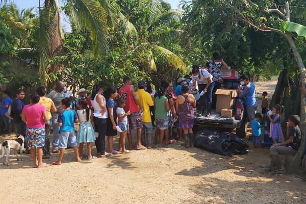 Residents of Trujillo, Honduras, line up for supplies on Nov. 12. The country, already hit hard with the COVID-19 virus, was flooded by rains from Hurricanes Eta and Iota in November. (Courtesy Father Gildo Ramírez)