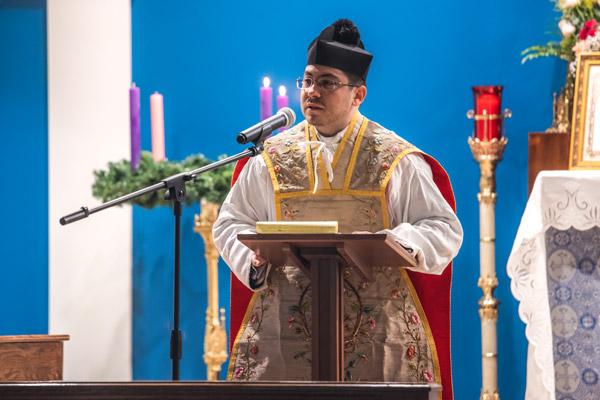 Father Joshua Passo, assistant administrator of Our Lady of Sorrows Church in Springdale, addresses the congregation Dec. 12 during its first Mass. Father Passo will be transitioning from Cabot to live full time in Springdale. (Travis McAfee photo)