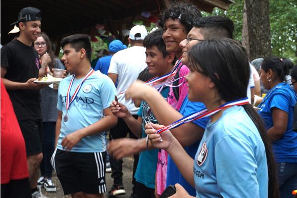 Youth show off their soccer medals after a tournament at St. Andrew Church’s annual parish festival Aug. 14 in Danville. (Aprille Hanson Spivey photo)