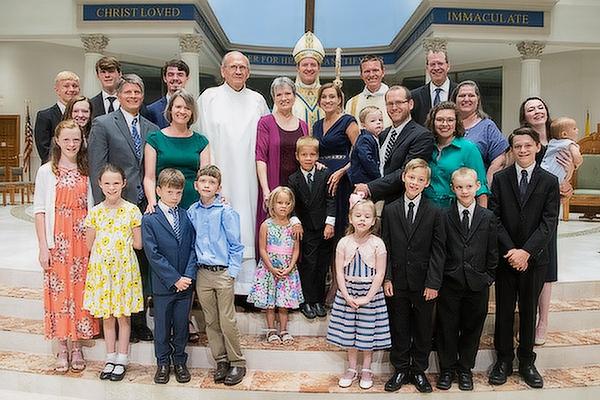 Bishop Erik T. Pohlmeier poses with his extended family outside of St. Joseph Church in Jacksonville, Fla., following his episcopal ordination, July 22. 
