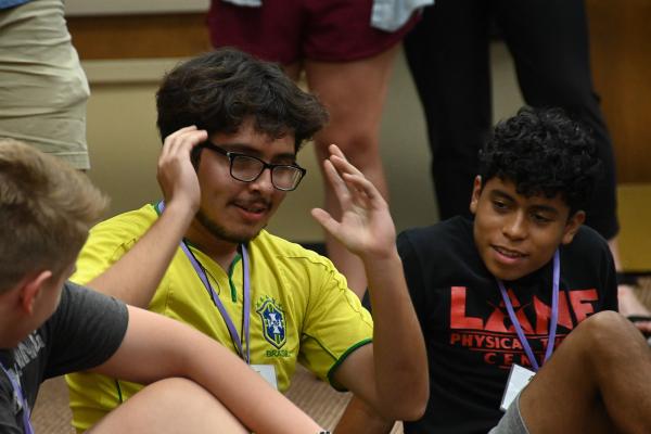 Angel Martinez of St. James Church in Searcy describes his experiences with his small group after the cookout at Jericho Way July 11. (Collin Gallimore photo)