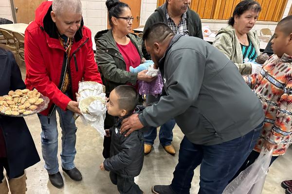 Following the rocking of the Christ Child at St. Rose of Lima in Carlisle, parishioners line up to kiss each Christ Child and receive treats from the godparents. All photos taken by Father Shaun Wesley.