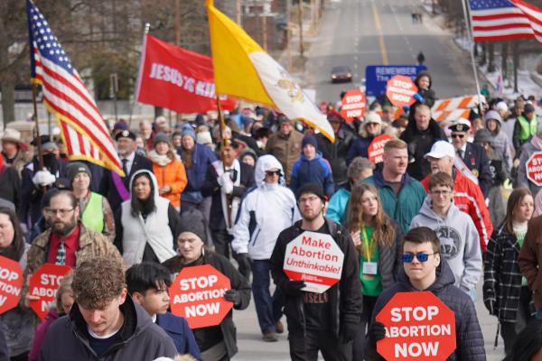 Hundreds of marchers bore flags and signs, calling for an end to abortion everywhere. 