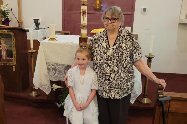 Marietta Marcotte, 84, takes pictures with her great-grand-daughter, Nora Grace Radley, after her baptism at St. Leo Church in Hartford April 8, 2023. Courtesy Marietta Marcotte. 