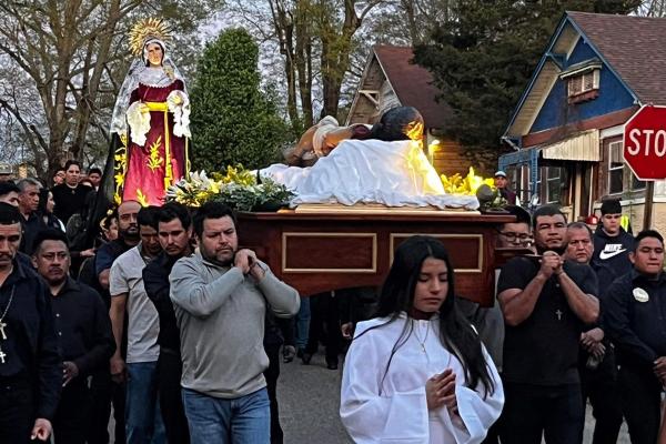 Parishioners at St. Barbara Church in De Queen march through the streets with a display of Jesus and the Virgin Mary during a Good Friday procession. (Courtesy Father Father Ramsés Mendieta)