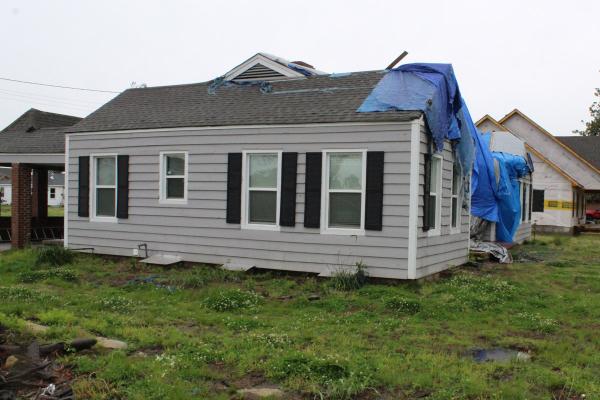 A house belonging to the mother of Jacob Hess, a parishioner of St. Peter Church in Wynne, is covered by a blue tarp, awaiting repairs after the March 31, 2023 deadly EF3 tornado that killed four Wynne residents. Photo taken April 11, 2024. (Katie Zakrzewski)