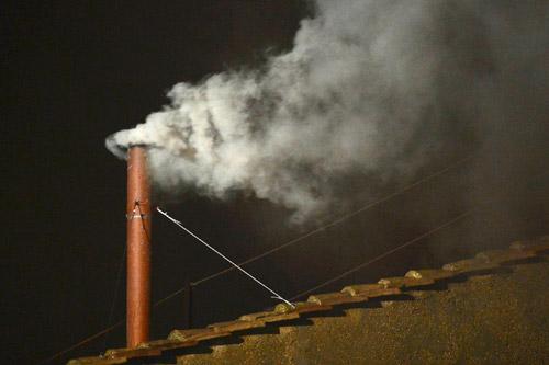 White smoke rises from the chimney above the Sistine Chapel in the Vatican, indicating a new pope has been elected, March 13. The conclave to elect a new pope met over two days before making a decision.
(CNS/Dylan Martinez, Reuters)