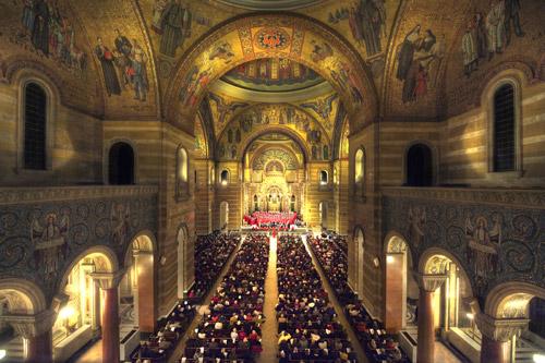 Construction on the Cathedral Basilica of St. Louis, shown here during Christmas Mass, was begun in 1907. The mosaics cover three domes, ceilings, nu-merous arches and wall panels, forming one of the largest collections of mosaic art in the Western hemisphere. Lisa Johnston, St. Louis Convention and Visitors Commission