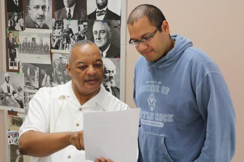 On the last day of class, Emmanuel Torres discusses a final paper assignment with his sociology professor Dr. David Briscoe of the University of Arkansas Little Rock. Dwain Hebda photo