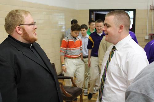 Seminarians are influential in the larger Catholic community, inspiring other young men to consider a similar vocation. Here, Jerry Wilkerson congratulates Little Rock Catholic High senior Steven Kelley at Kelley’s signing ceremony, a public event celebrating his decision to enter the seminary after graduation. Dwain Hebda photo