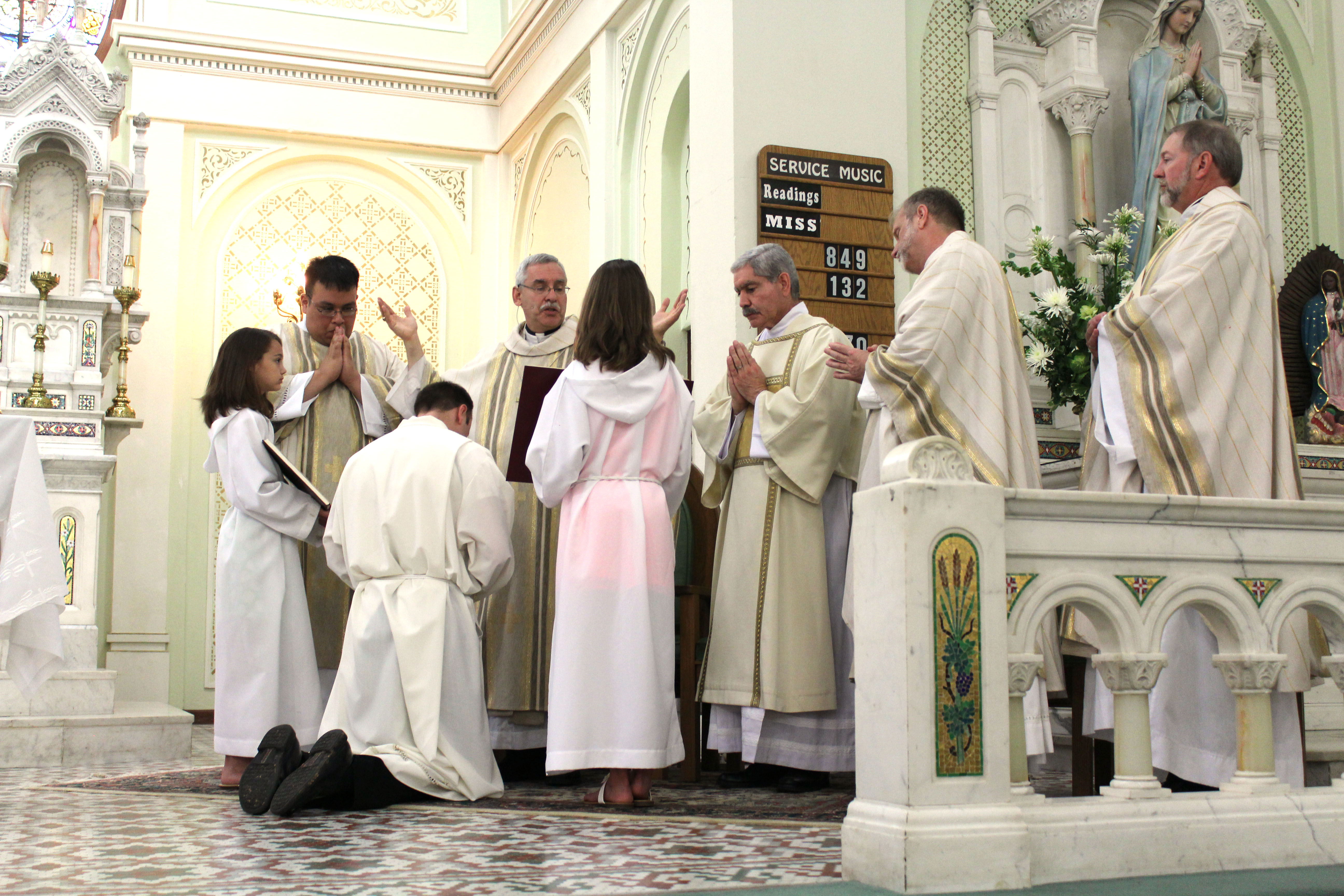 Bishop Anthony B. Taylor delivers the prayer of ordination to Robert Cigainero May 25. Dwain Hebda photo