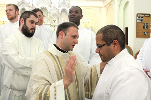 Deacon Cigainero blesses his fellow seminarian Emmanuel Torres of North Little Rock. Dwain Hebda photo