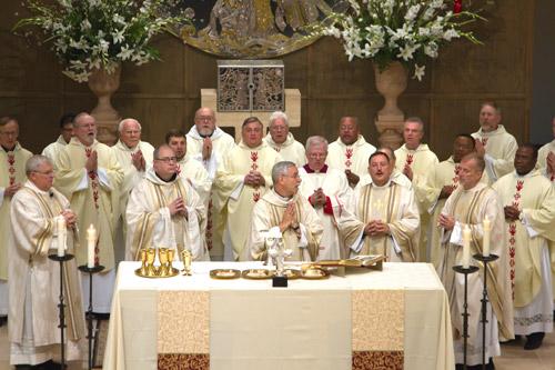 The ordination Mass was concelebrated by Bishop Taylor (center), Father Sanders (right) and 23 other priests. Bob Ocken photo