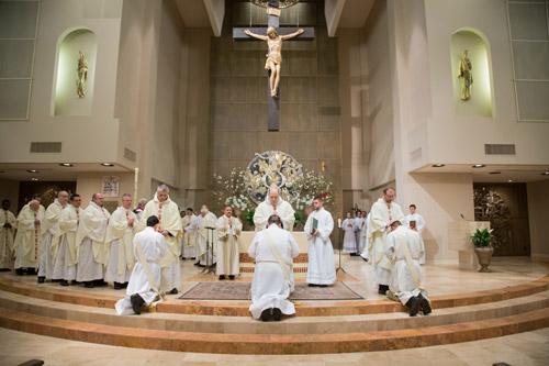 Priests from around the state attended the ordination and laid hands on each of their three new brothers. Bob Ocken photo