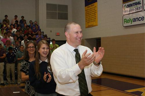 Deacon Danny Hartnedy, his daughter Mary Catherine and wife Stephanie, applaud their son John Paul Hartnedy, the only graduating senior to participate in this year’s Catholic High signing day. (Aprille Hanson)