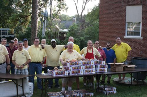 District 1 Knights of Columbus, including Arkansas State Council Grand Knight Marc Rios (right), provided 900 hot dogs, chips and lemonade for the Rosary Rally. (Aprille Hanson)