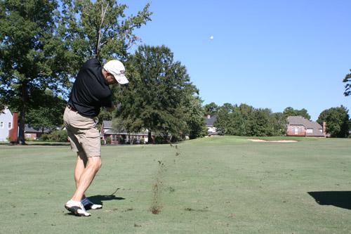 Lann Smith, member of Immaculate Heart of Mary in North Little Rock (Marche), takes his swing on a par 4 hole. His four-man group had all played in the Bishop McDonald-Catholic Charities Golf Classic in past years. (Aprille Hanson photo)