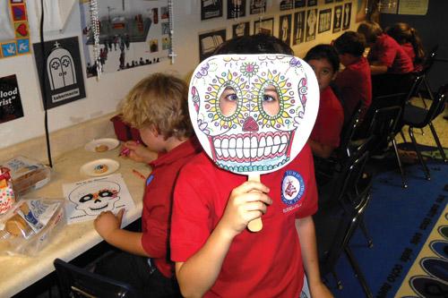 Spanish classes at St. John School in Russellville make masks and decorate sugar cookies as part of a study on the Day of the Dead.  The Day of the Dead is a Mexican celebration held Nov. 2 each year. Students decorated skull-shaped masks, which people often wear during the celebration. (Prints of this photo are not available.)