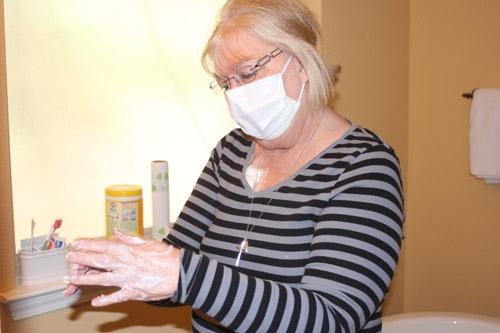 To keep sanitary before starting dialysis, Martha said she must wash her hands for two minutes straight and not touch anything after but her dialysis supplies. (Aprille Hanson)