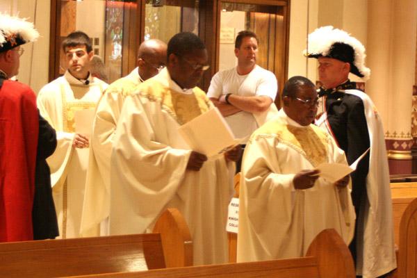 25-year jubilarians Father Stephen Mallanga, AJ, (left), Father Chris Okeke and Father Athanasius Okeiyi (back) process into the Jubilee Mass June 27 at the Cathedral of St. Andrew in Little Rock. (Aprille Hanson photo)
