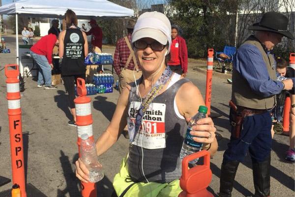Catholic High teacher Stephanie Hartnedy completes her first half-marathon Feb. 12 in Fort Smith. (Courtesy Catholic High School) Prints not available for this photo.