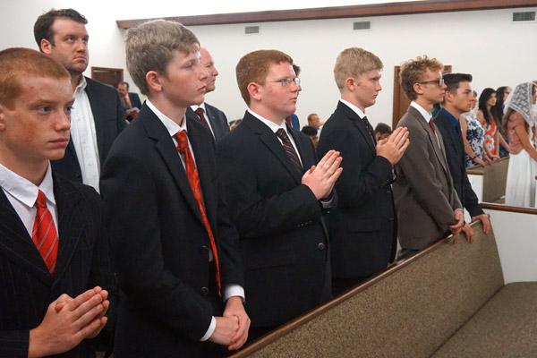 Confirmation candidates stand as Bishop Anthony B. Taylor prays June 24. The young men pictured are (from left) Anthony Sonnier, 14, of Batesville; Kevin McCann, 14, Max McCann, 15, and James McCann, 15, all of Batesville; Thomas Sonnier, 15, of Batesville; and Phillip Car, 15, of Benton. (Aprille Hanson photo)