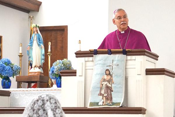 Bishop Taylor explains to parishioners of St. John the Baptist Church in Cabot the policies and rules for being an official church in the Diocese of Little Rock June 24. (Aprille Hanson photo)