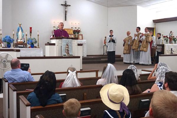 Bishop Taylor officially names St. John the Baptist Church in Cabot as a parish of the Diocese of Little Rock and describes related policies to a packed church June 24. (Aprille Hanson photo)