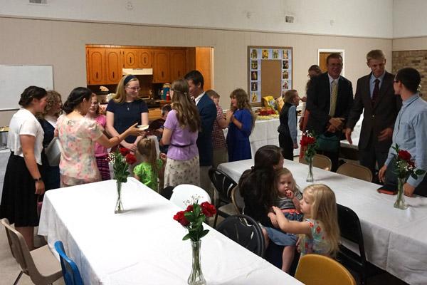 Parishioners of St. John the Baptist Church in Cabot celebrate in their new parish hall after being officially named a parish of the Diocese of Little Rock June 24. (Aprille Hanson photo)