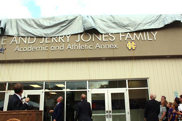 Members of the Gene and Jerry Jones family unveil the front of the 30,000-square-foot Gene and Jerry Jones Family Academic and Athletic Complex Aug. 30. (Dwain Hebda photo)