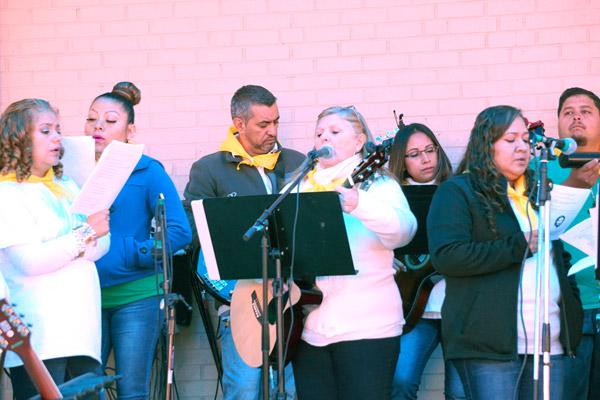 A bilingual choir, made up of faithful from North Little Rock, Little Rock and Jacksonville, sang at the Nov. 11 Mass. (Malea Hargett photo)