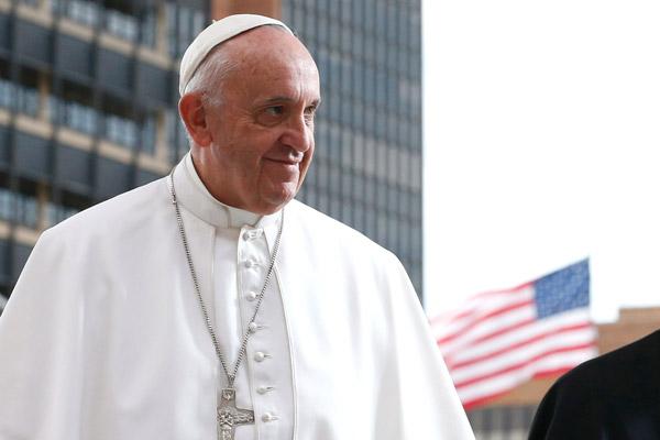 Pope Francis leaves a meeting for religious liberty with the Hispanic community and immigrants on Independence Mall in Philadelphia in this Sept. 26, 2015, file photo. In Washington the pope visited the White House and made history as the first pope to address Congress; in New York he spoke at the U.N. and visited ground zero; in Philadelphia he led the World Meeting of Families. (CNS / Paul Haring)