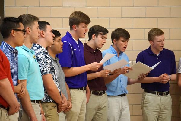 The Catholic High School Schola Choral Group performs at the start of the annual signing day ceremony May 1. (Aprille Hanson photo)