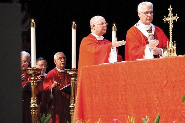 Bishop Anthony B. Taylor (left) concelebrated the beatification Mass of Father Stanley Rother Sept. 23, 2017, with Archbishop Paul S. Coakley (right) of Oklahoma City and Archbishop Peter Wells of South Africa. (Malea Hargett / Arkansas Catholic file)
