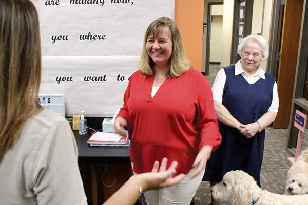 Amy Owens and Sister Joan Pfauser, RSM, greet a student in the counseling office at Mount St. Mary Academy in Little Rock. The school emphasizes a number of counseling options for students. (Dwain Hebda photo)