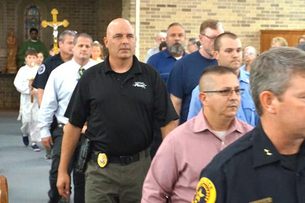First responders process into St. Joseph Church in Conway at the start of the Blue Mass, celebrated by Bishop Taylor Sept. 11. (Aprille Hanson photo)