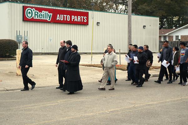 Pastor Father Eddie D'Almeida and visiting priests and deacons lead a procession in Warren from the former St. Luke Church one mile to the new church Nov. 23. (Malea Hargett photo) 